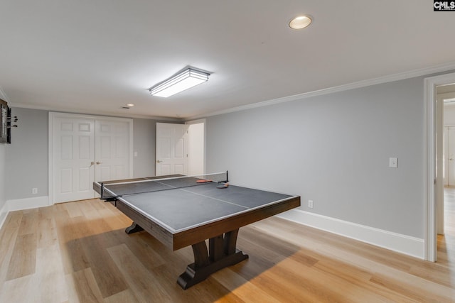 playroom featuring ornamental molding and light hardwood / wood-style floors