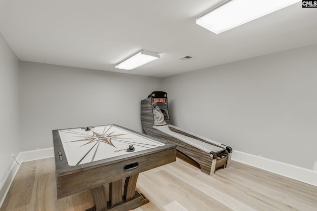 playroom with light hardwood / wood-style flooring