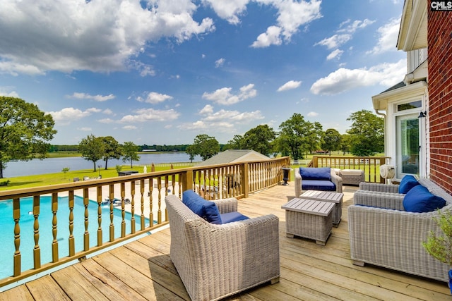 wooden terrace with outdoor lounge area and a water view