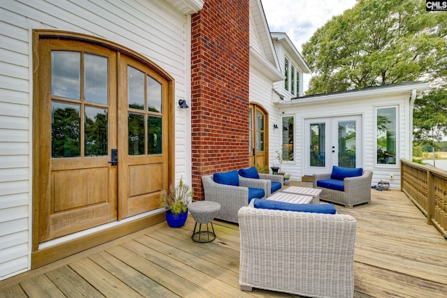 deck with outdoor lounge area and french doors