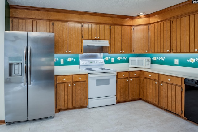 kitchen featuring a textured ceiling and white appliances