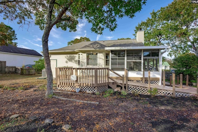 view of front of property featuring a deck and a sunroom