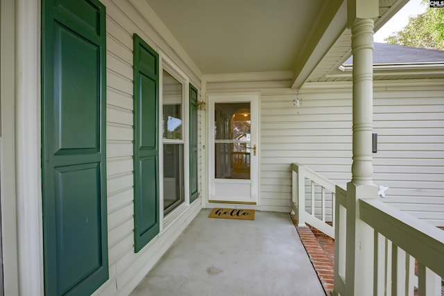 view of exterior entry with a porch