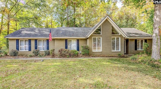 ranch-style home featuring a front yard