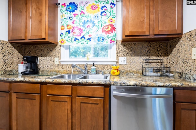 401 Nottingham Rd, Columbia, SC 29210 - kitchen featuring brown cabinetry, dishwasher, light stone counters, a sink, and backsplash