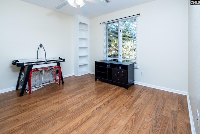 miscellaneous room featuring a textured ceiling, hardwood / wood-style flooring, and ceiling fan