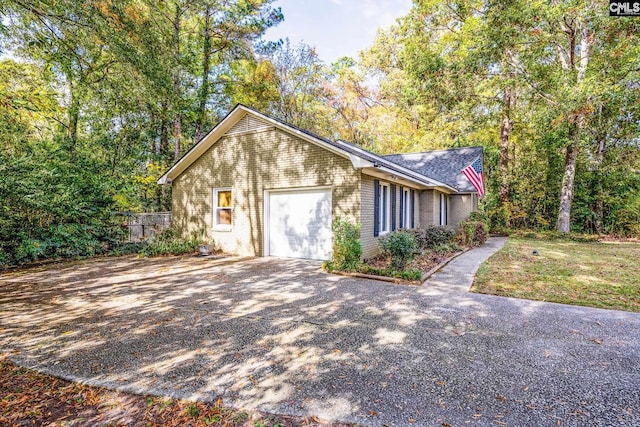 401 Nottingham Rd, Columbia, SC 29210 - exterior space featuring a garage, fence, concrete driveway, and brick siding