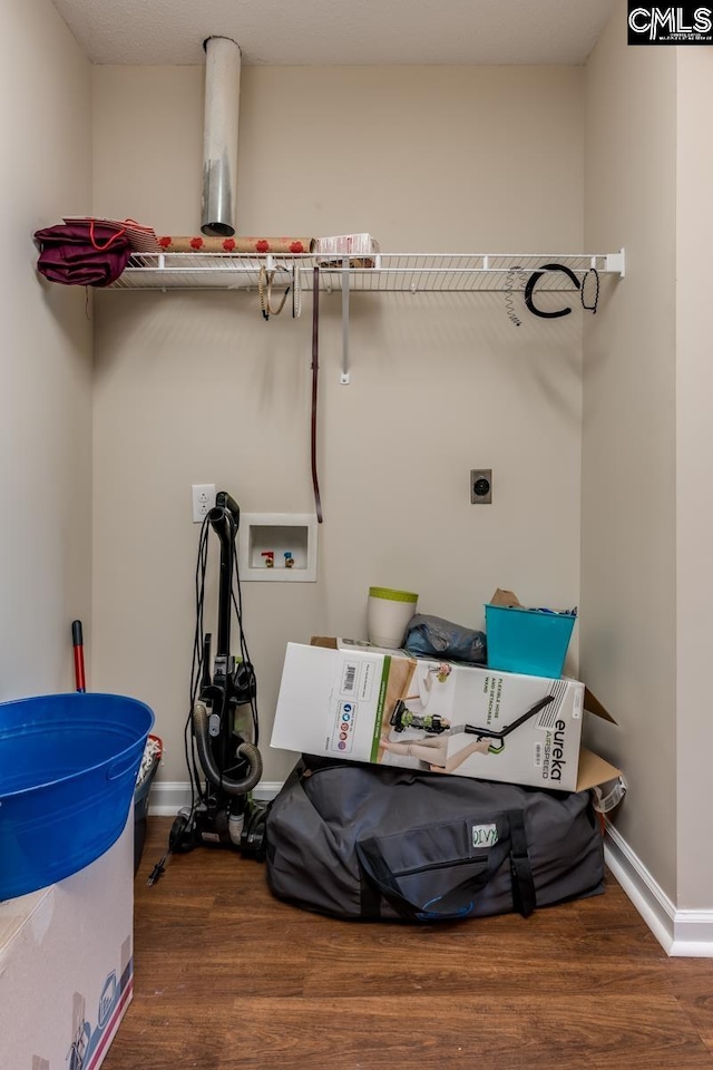 washroom featuring washer hookup, hookup for an electric dryer, and dark hardwood / wood-style floors