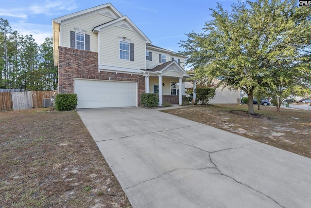 420 Indigo Ridge Dr, Columbia, SC 29229 - craftsman-style house featuring a garage, fence, brick siding, concrete driveway, and a porch