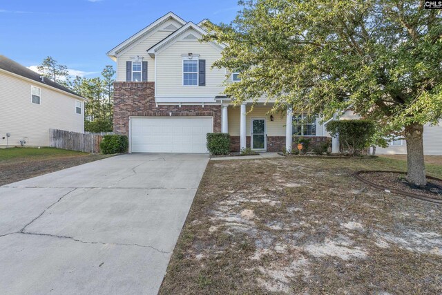 420 Indigo Ridge Dr, Columbia, SC 29229 - traditional home with brick siding, a garage, fence, and driveway
