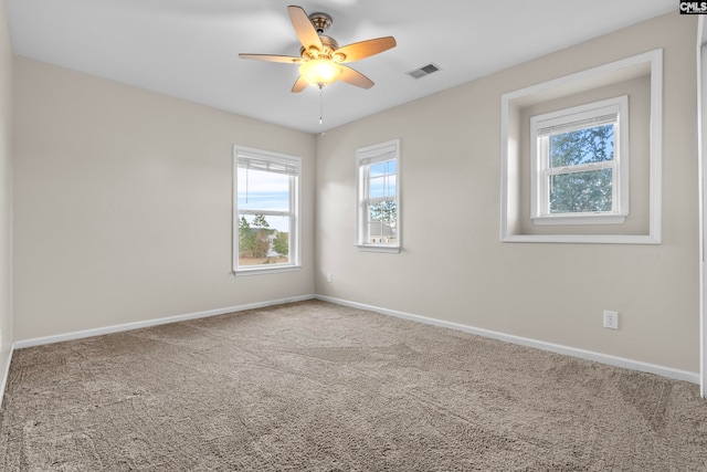 empty room with carpet flooring and ceiling fan