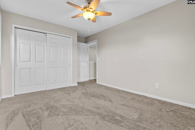 unfurnished bedroom with light carpet, a closet, and ceiling fan