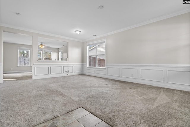 420 Indigo Ridge Dr, Columbia, SC 29229 - unfurnished living room featuring crown molding, wainscoting, ceiling fan, and light carpet