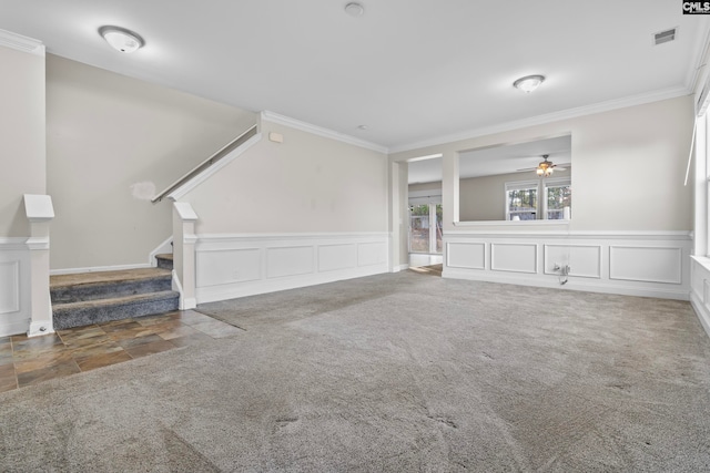 unfurnished living room featuring ornamental molding and carpet flooring