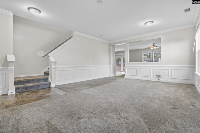 420 Indigo Ridge Dr, Columbia, SC 29229 - unfurnished living room featuring crown molding, a decorative wall, stairs, and visible vents