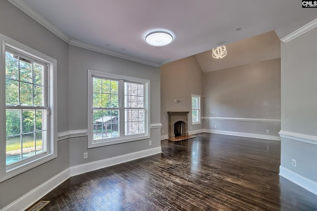 unfurnished living room featuring a wealth of natural light, crown molding, and dark hardwood / wood-style flooring