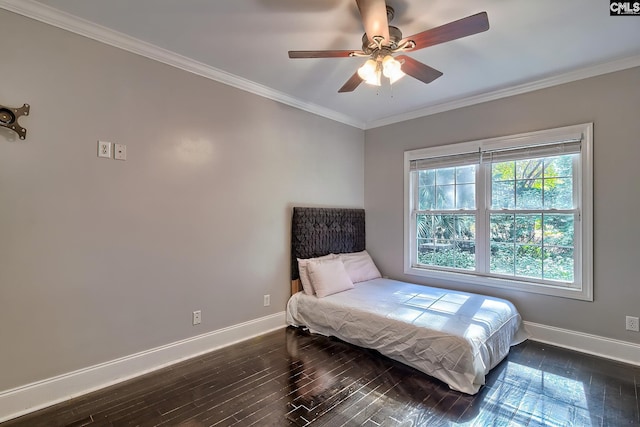 bedroom with dark hardwood / wood-style flooring, crown molding, and ceiling fan