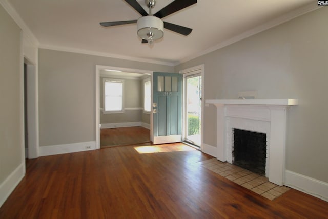 unfurnished living room featuring ornamental molding, a brick fireplace, hardwood / wood-style floors, and ceiling fan