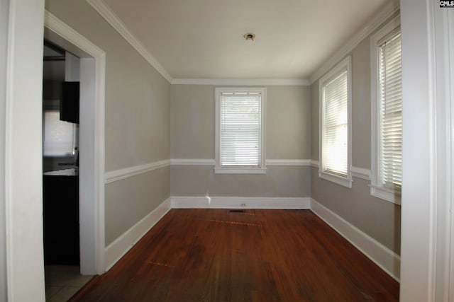 unfurnished dining area with dark wood-type flooring and ornamental molding