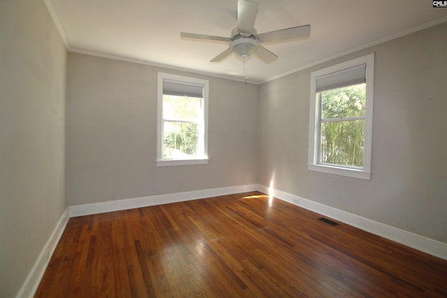 empty room with ornamental molding, hardwood / wood-style flooring, and ceiling fan