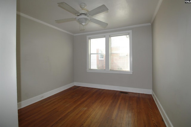 unfurnished room featuring crown molding, dark hardwood / wood-style floors, and ceiling fan