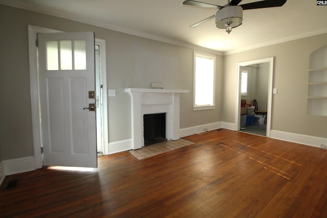 unfurnished living room with ornamental molding, hardwood / wood-style floors, plenty of natural light, and ceiling fan