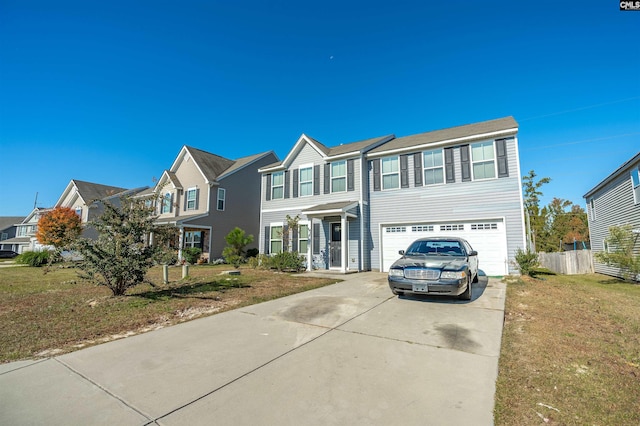 view of front of property with a front yard and a garage