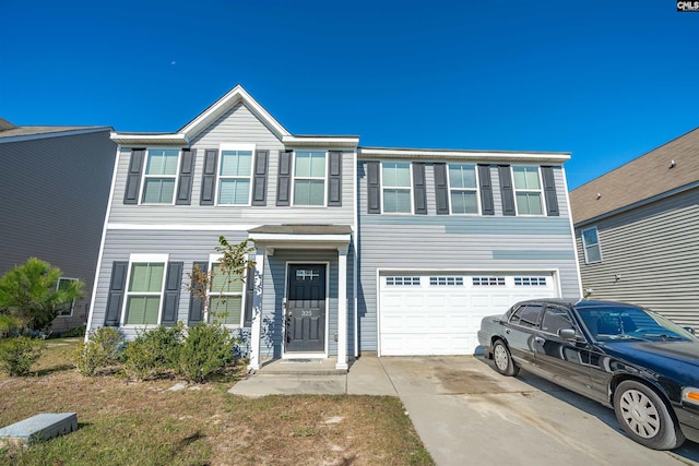 townhome / multi-family property featuring a garage