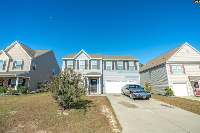 view of front of home with an attached garage, driveway, and a front lawn