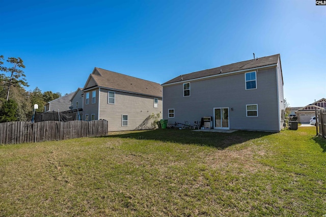 back of property featuring a patio area, a yard, and cooling unit