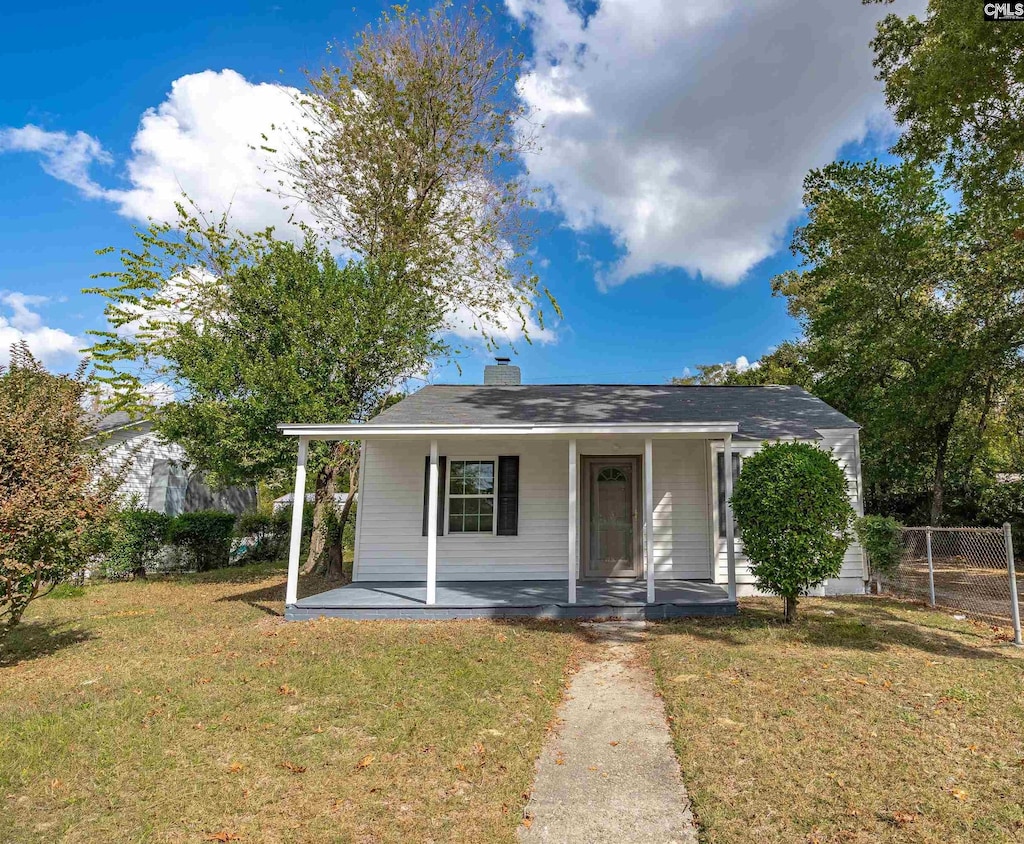 view of front of property with a front yard and a porch