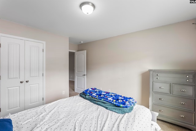 carpeted bedroom with a closet