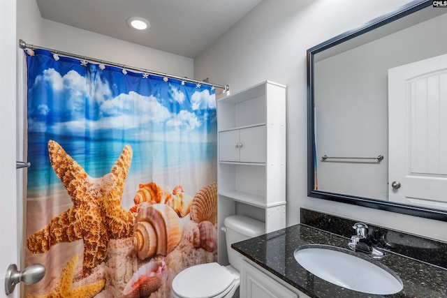 bathroom featuring vanity, a shower with curtain, and toilet