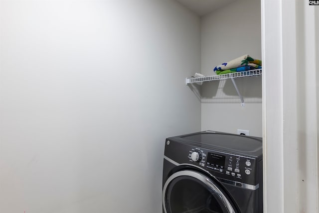 washroom with washer / dryer