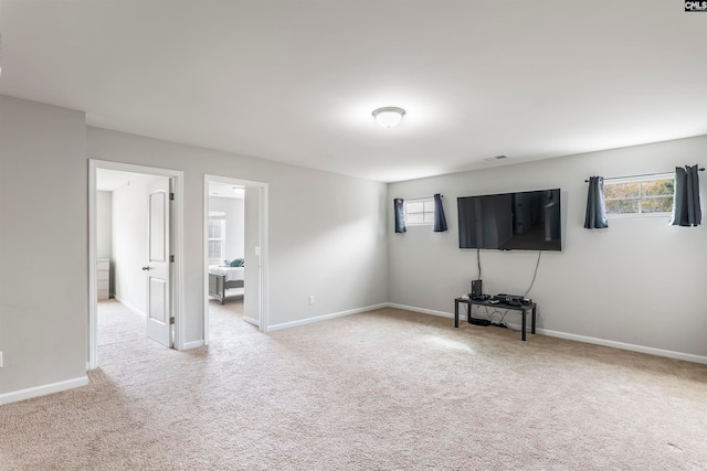 unfurnished living room with light carpet