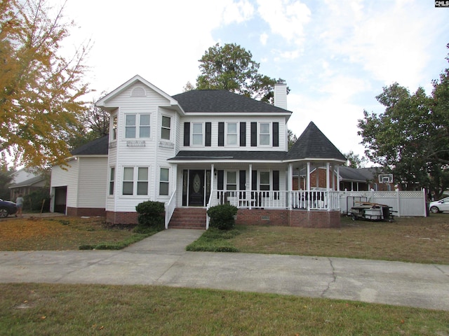 view of front of home featuring a front yard and a porch