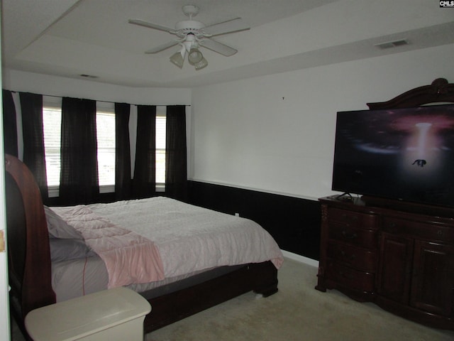 bedroom featuring light colored carpet and ceiling fan