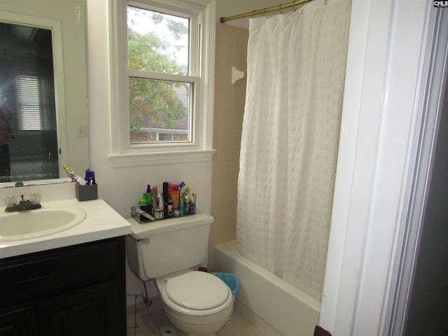 full bathroom with vanity, shower / bath combo with shower curtain, and toilet