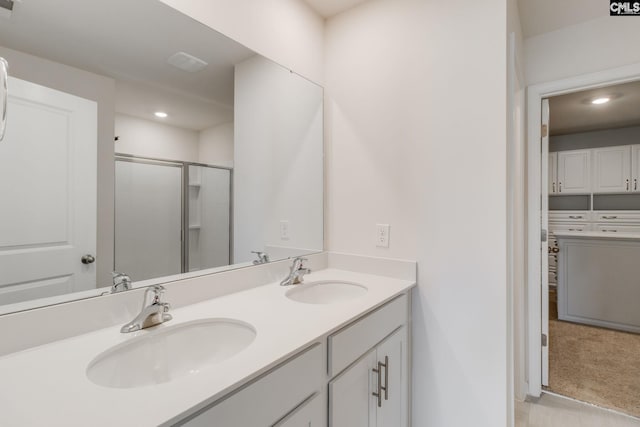 bathroom with vanity and walk in shower