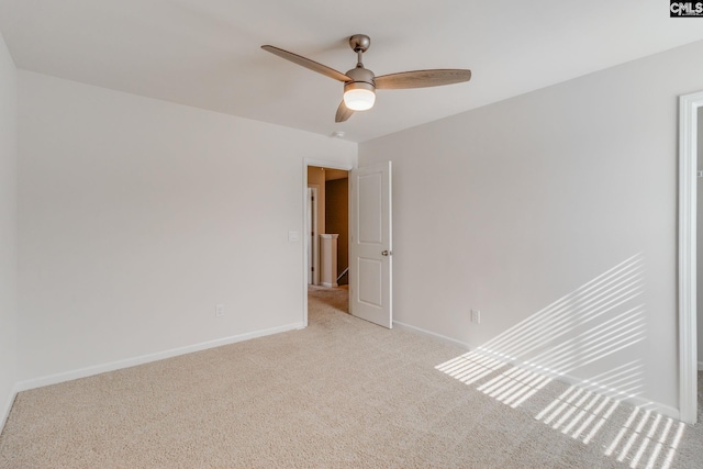 carpeted empty room with ceiling fan