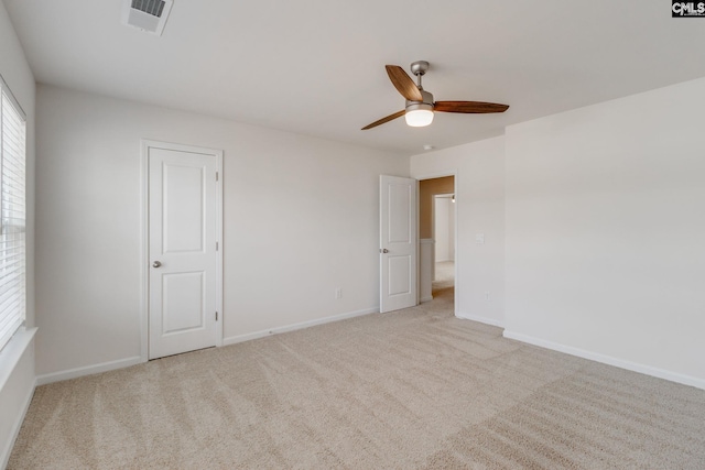 empty room with light carpet and ceiling fan