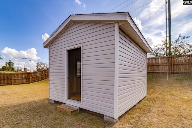 view of outdoor structure with a yard