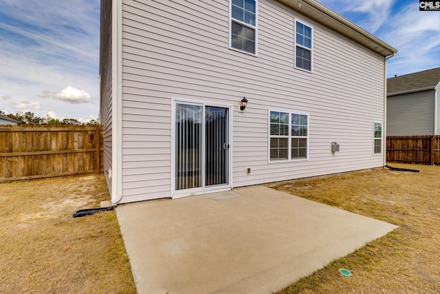 rear view of property featuring a patio area