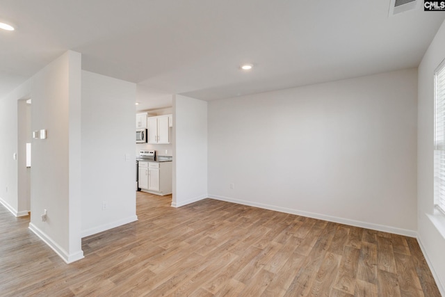 unfurnished living room with light hardwood / wood-style flooring