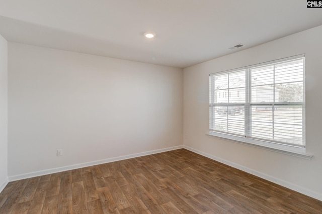 unfurnished room featuring dark hardwood / wood-style floors