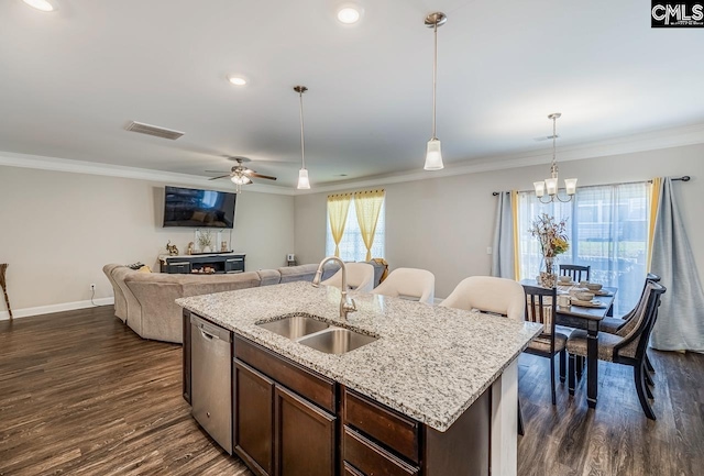 kitchen with sink, an island with sink, ceiling fan with notable chandelier, dishwasher, and dark hardwood / wood-style flooring