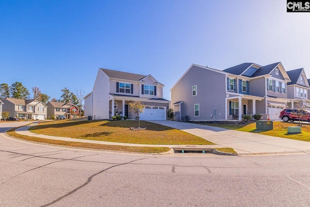 view of front of house with a front lawn and a garage