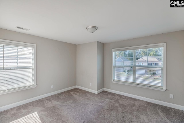 empty room featuring light carpet