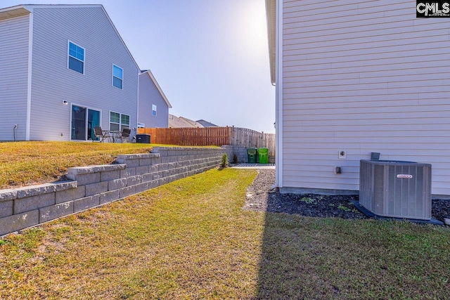 view of yard with central AC unit