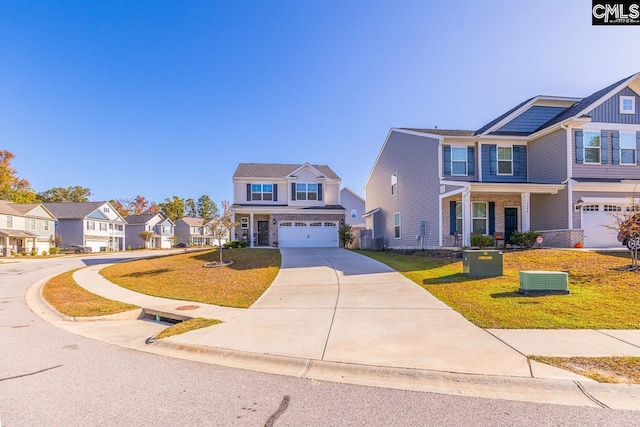 view of front of home with a front yard, central AC, and a garage